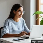 Home 19 미니멀리즘 경제학과 디지털 경제 - A young Brazilian woman sitting comfortably at a modern home office desk, using a laptop with financ...